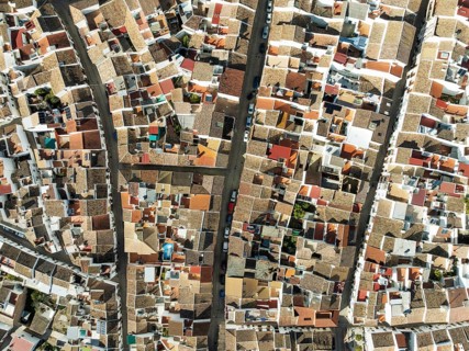Streets and rooftops in the White Town of Olvera. Aerial view. Drone shot. Cádiz province,