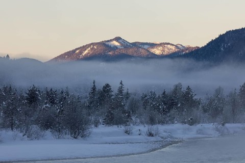 Isar valley in winter at temperatures of minus 18 degrees Celsius. Snow covered landscape with the