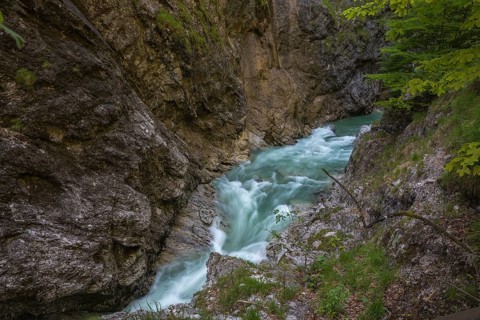 The Lammer creek is flowing fast through the Lammerklamm on a sunny hiking day