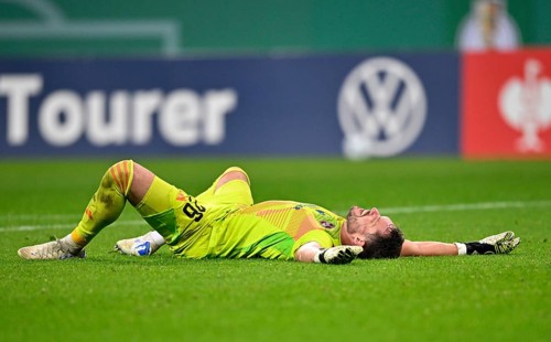 Goalkeeper Christian Mathenia 1. FC Nürnberg FCN (24) lies disappointed on the groundDFB-Pokal,