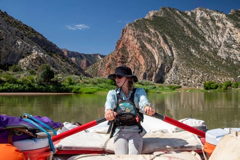 Dinosaur, Colorado, River guide Abbey Woodruff rows her raft on the Green River in Dinosaur