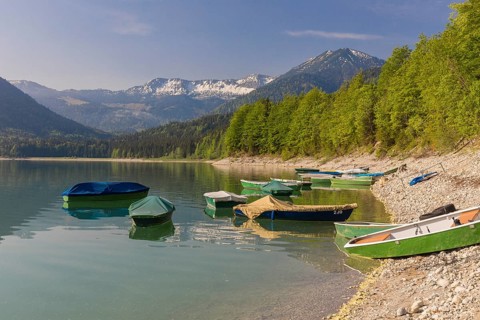 Boats at the beach. Early morning at the Sylvenstein reservoir, Reservoir in the Isarwinkel,