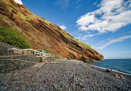 On the beach of Garajau, Ponta do Garajau stone beach, bathing beach, cliffs, Garajau, municipality
