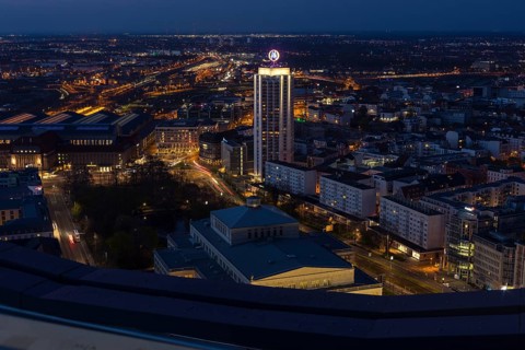 View of the city at night from the city tower block looking north with the main railway station and