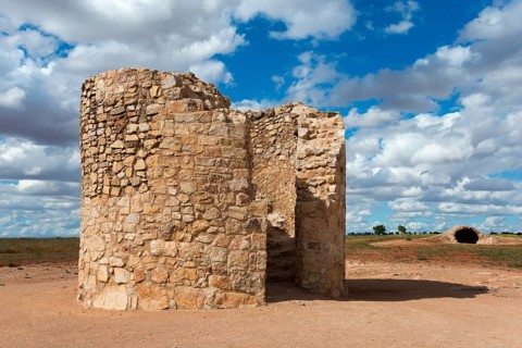 An old wall-like ruin of stones under a cloudy sky, Molino Castaño, Castaño Mill, Campo de
