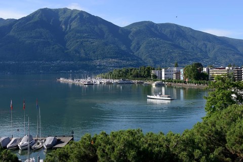 View of Lake Maggiore with marina and town, Locarno, Canton Ticino, Switzerland, Europe