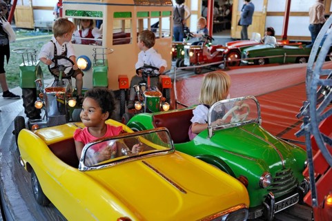 Boys and girls on car in carousel, old, historic Oktoberfest, Oktoberfest, Munich, Upper Bavaria,