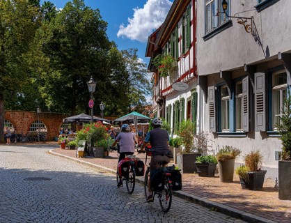 Cyclist in the old town centre, Seligenstadt, Hesse, Germany, Europe