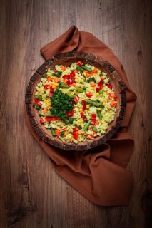 Couscous with vegetables, paprika, carrots, string beans, corn, homemade, top view, no people