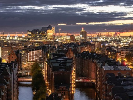 Aerial view of Hamburg warehouse district with Elbe Philharmonic Hall concert hall at sunset,