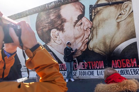 East Side Gallery. Remnant of the Berlin Wall, designed by artists. Landmark and city view Berlin,