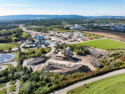 Aerial view of a gravel pit, gravel extraction area, gravel works, asphalt mixing plant and