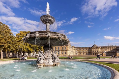 Palace square with New Palace. Fountain with fountain bowl. Place of interest in Stuttgart,