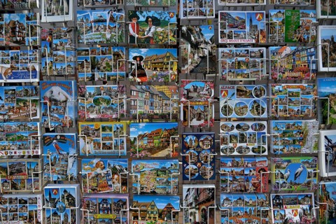 Postcard stand with Alsace postcards, Obernai, Bas-Rhin, Alsace, France, Europe