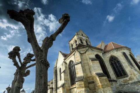 Auvers-sur-Oise. Notre-Dame-de-l'Assomption church painted by Vincent Van Gogh. Val-d'Oise