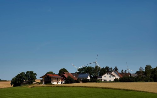 Wind turbines, solar cells on house roof, wheat field, Barholomä, Swabian Alb, Baden-Württemberg,