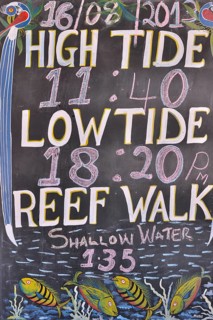 Sign with tidal information outside a diving school, Dongwe, Zanzibar, Tanzania, Africa