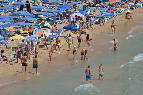 Bathers on Playa Levante, Benidorm, Costa Blanca, Spain beach