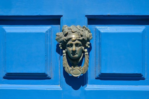 Head shaped door knocker on a blue door, Mykonos Town or Chora, Mykonos, Cyclades, Greece, Europe