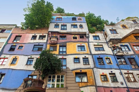 Colorful Facade of Hundertwasserhaus, apartment house designed by Friedensreich Hundertwasser in