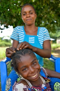 Mother doing her daughter's hair, Nkala, Bandundu Province, Democratic Republic of the Congo