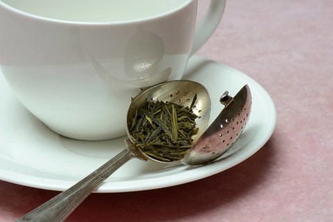 Tea leaves in tea strainer (Sencha) tea, green tea