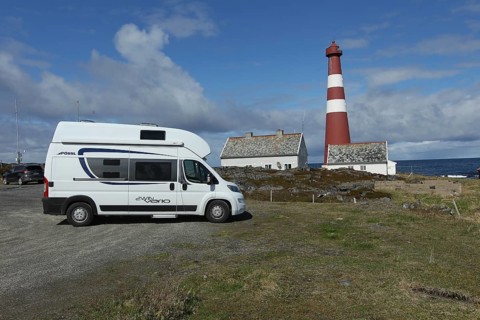 Motorhome in front of Gamvik lighthouse, the northernmost point in Norway accessible by car on the