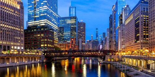 Skyline skyscrapers skyscrapers on the Chicago River bridge panorama at night in Chicago, USA,