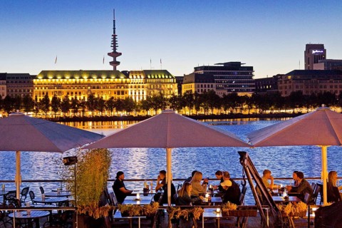 People on the restaurant ship Bootshaus Alster on the Inner Alster Lake in the evening, Hamburg,