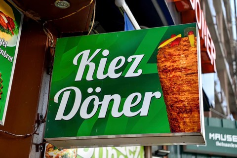 Billboard on a kebab stand on the Reeperbahn, St. Pauli, Hamburg, Germany, Europe