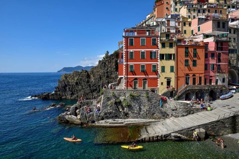 Sea kayaks in the harbour of Riomaggiore, Cinque Terre, province of La Spezia, Liguria, Italy,