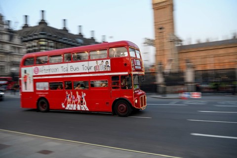 Red double-decker bus at the Houses of Parliament, Westminster, London, England, United Kingdom,