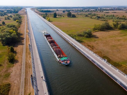 Drone shot, cargo ship on the Mittelland Canal, Magdeburg waterway junction, canal bridge,