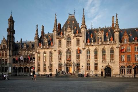 BRUGES, BELGIUM, MAY 28, 2018: Famous tourist destination Grote markt square and Provincial Court