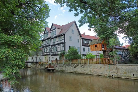 Half-timbered house and tree house on the river Gera, wooden construction, wooden house, idyll,