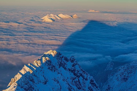 Mountain peaks above high fog, evening light, winter, view from Zugspitze to Waxensteine and