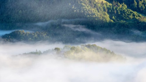 Morning fog over the village of Berchtesgaden in the valley, Berchtesgaden National Park, Upper