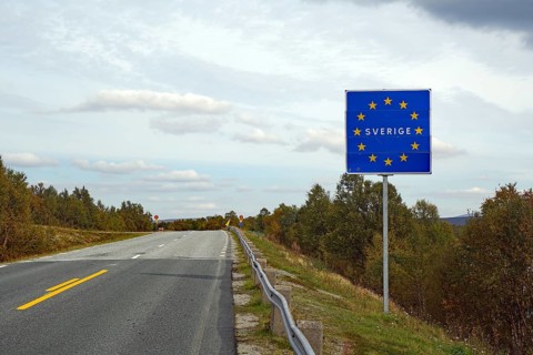 European sign on a road, showing the border to Sweden under a cloudy sky, Jämtland, Sweden, Europe