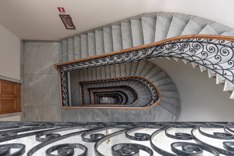 Staircase around 1900 with a wrought-iron banister, in a residential building, Genoa, Italy, Europe