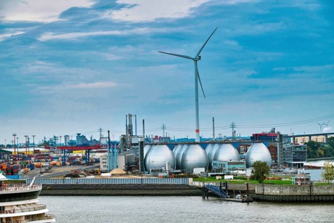 Wind turbine and Hamburg sewage treatment plant at the harbour, Hamburg, Land Hamburg, Germany,