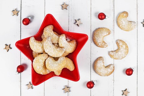 Top view of crescent Christmas cookies called 'Vanillekipferl', a traditional Austrian or German