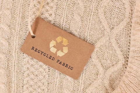 Knitted fabric with label saying 'recycled fabric'