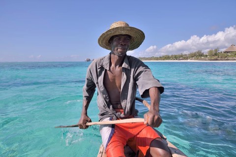 Local fisherman in his boat, Dongwe Beach, Dongwe, Zanzibar, Tanzania, Africa