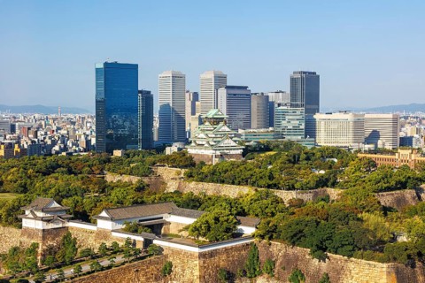 Osaka Castle from above with the skyline skyscrapers in Osaka, Japan, Asia