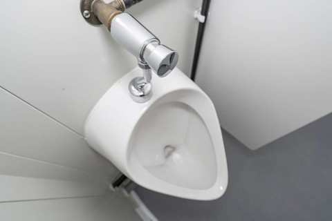 Close-up of a white urinal in a modern style, refugee accommodation Beermiß, Calmbach, Black