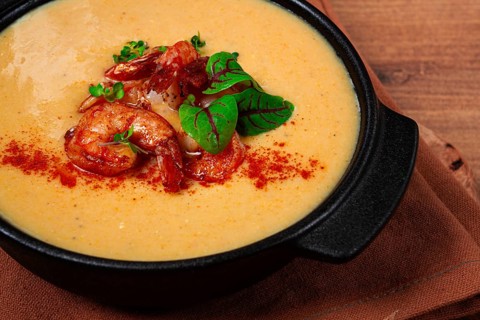 Pumpkin cream soup with shrimp, herbs and spices, homemade, no people
