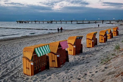 Abandoned beach chairs, Baltic Sea beach, Baltic Sea coast with the Wustrow pier, evening mood,