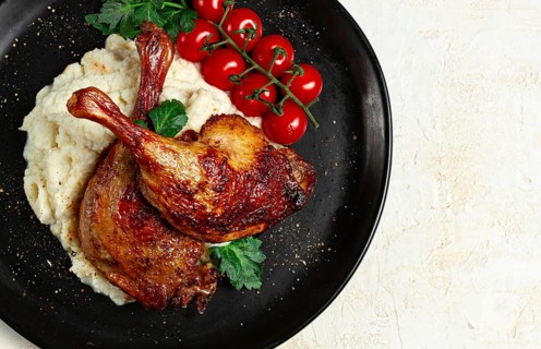 Fried duck shank, cauliflower puree, cherry tomatoes, homemade, no people