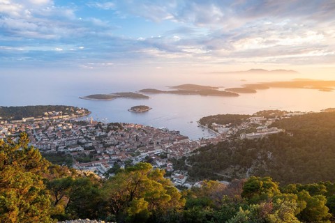 View of the old town centre of Hvar at sunset, behind Pakleni or Paklinski Islands, Dalmatia,