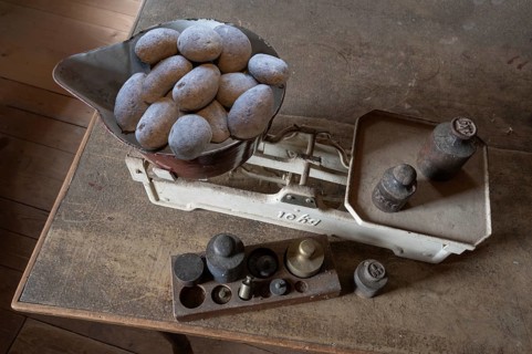 Old scales with weights in a former corn mill, Bavaria, Germany, Europe